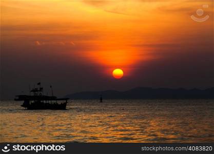 Fishing boat in Thailand. Silhouette of Fishing Boat on Sunrise.