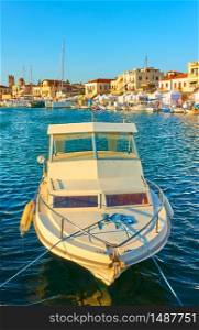Fishing boat in the port of Aegina in the sunny evening, Saronic Islands, Greece