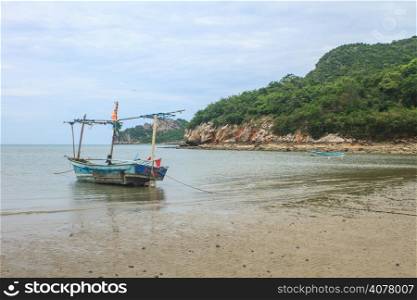 Fishing boat on the beach in summer