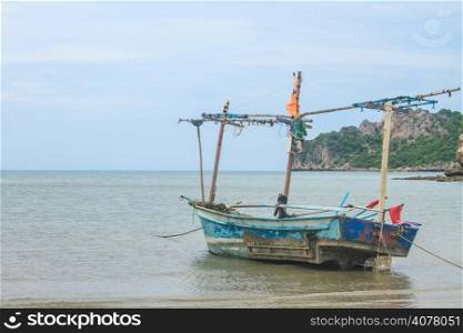 Fishing boat on the beach in summer