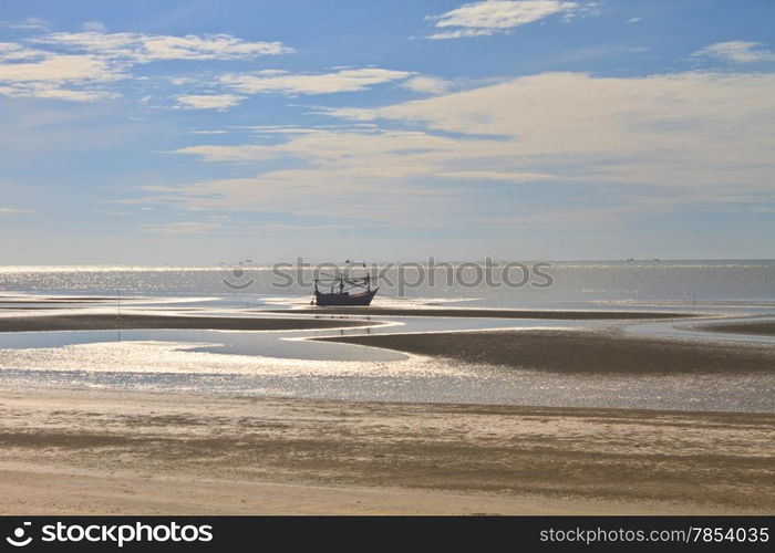 Fishing boat on the beach in summer