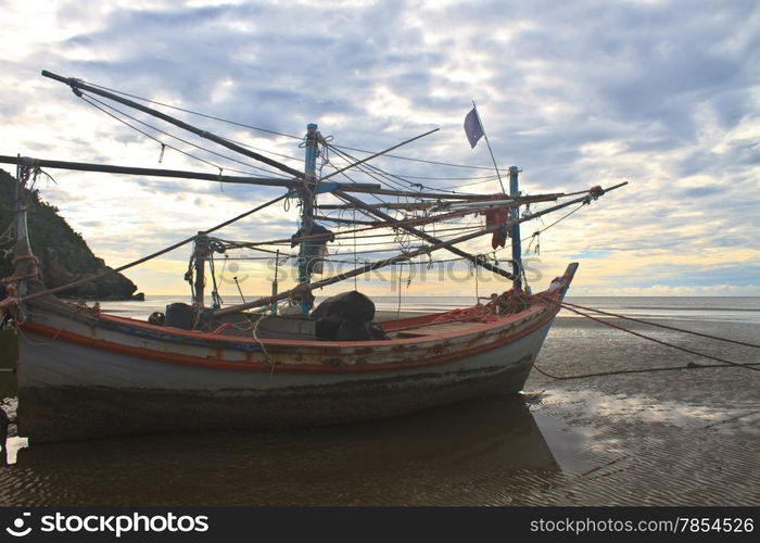 Fishing boat on the beach in summer