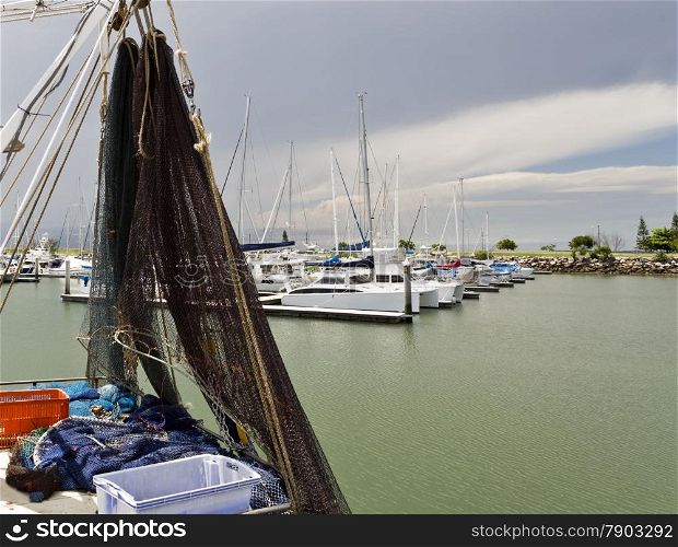 Fishing boat safely moored during an approaching storm in Scarborough, SE Queensland, Australia