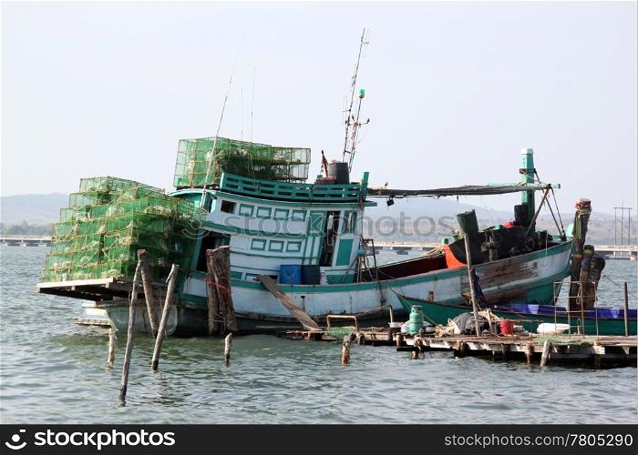 Fishing boat with net near thye sea coast in Cambodia