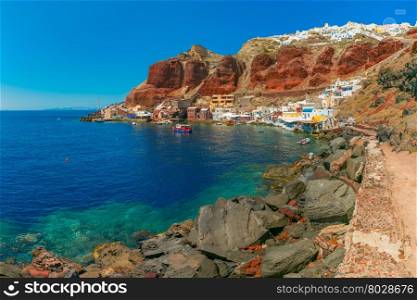 Fishing boats at Old port Ammoudi of Oia village at Santorini island in Aegean sea, Greece
