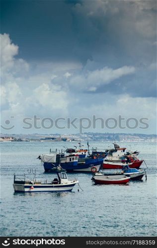 Fishing boats floating in the fish port of Cascais - Portugal.. Fishing boats floating in the fish port of Cascais - Portugal