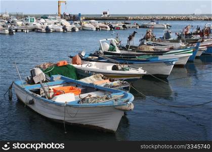 Fishing boats in Olhao&rsquo;s harbour in the Algarve, south coast of Portugal.