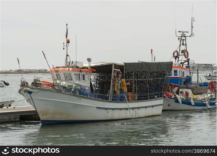 fishing boats in the water between tavira and ria formosa in Portugal Algarve Area
