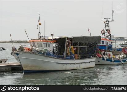 fishing boats in the water between tavira and ria formosa in Portugal Algarve Area