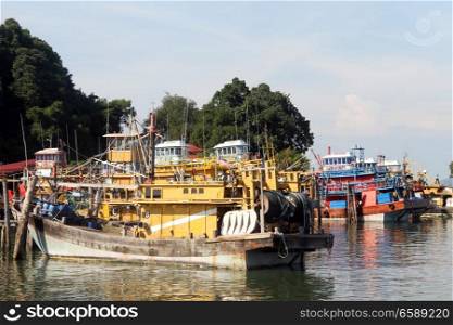 Fishing boats near pier of Pangkor island, Malaysia