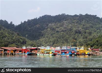Fishing boats near village on the Pangkor island, Malaysia