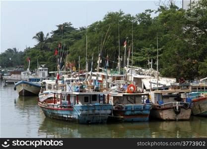 Fishing boats on the river in Negombo, Sri Lanka
