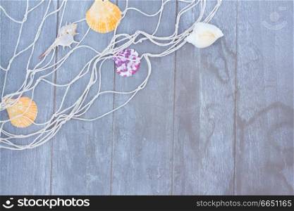 fishing net on gray wooden background with copy space. fishing net on wooden background