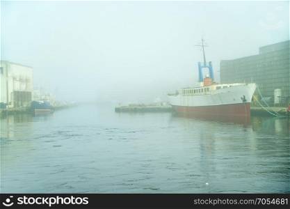 Fishing port of Ustka, Poland with morning fog