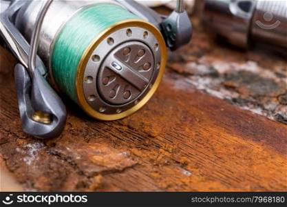 fishing reel with line on natural background