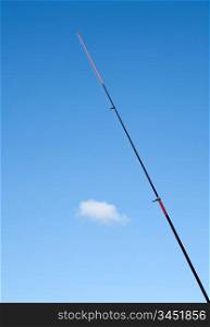 Fishing rod red against the blue sky