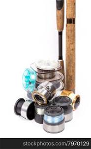 fishing rods and spools with line for reels on white background
