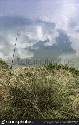 Fishing rods on a mountain lake
