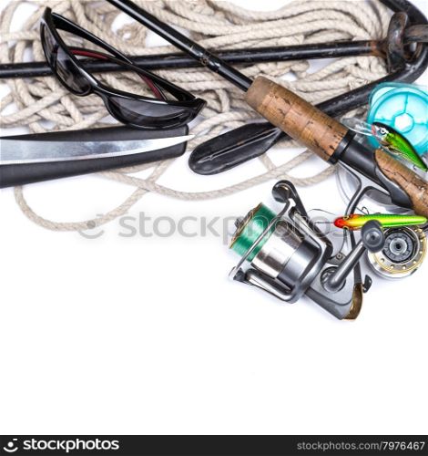 fishing tackles and anchor with cord on white background