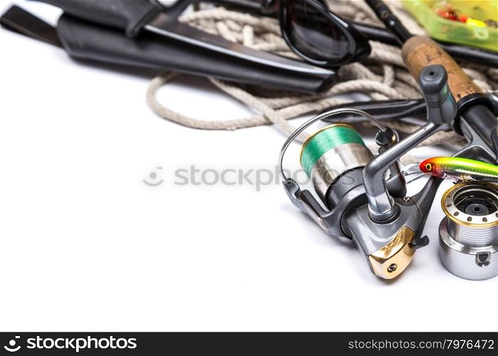 fishing tackles and anchor with cord on white background