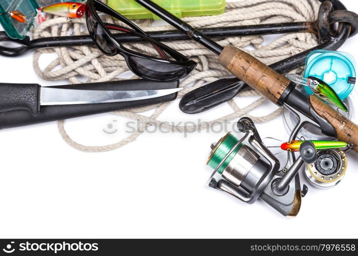 fishing tackles and anchor with cord on white background