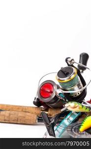 fishing tackles rods, reels, line and lures on white background