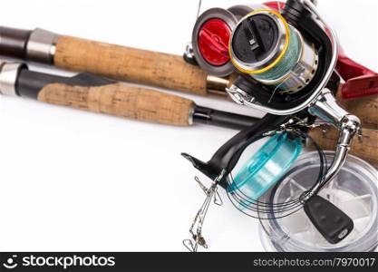 fishing tackles rods, reels, line and lures on white background