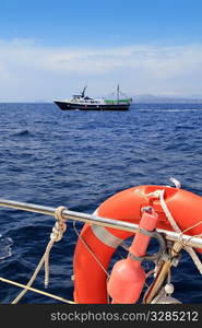 fishing trawler professional boat working in blue ocean sea