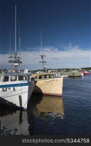 Fishing trawlers moored at Main-a-Dieu Harbour, Cape Breton Island, Nova Scotia, Canada