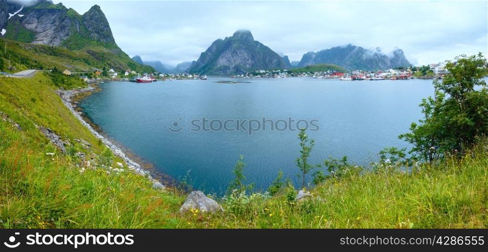 Fishing village Reine (Lofoten, Norway). Summer cloudy panorama.