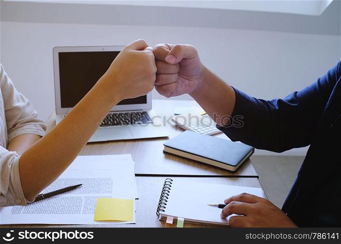 Fist Bump Corporate Colleagues teamwork concept