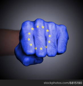 Fist punching, wrapped in an EU flag pattern