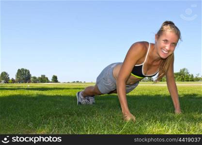 Fit, athletic woman doing push ups