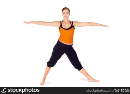 Fit attractive young woman doing first stage of yoga pose Warrior 2, isolated on white background