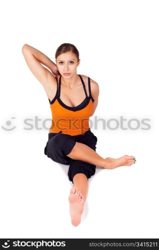 Fit beautiful woman doing yoga exercise called Gomukhasa Paschimottasana, isolated on white background