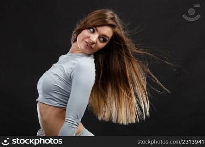 Fit fitness slim woman, positive sporty girl wearing hot gray sports thermolinen underwear, long sleeves top, studio shot on black. Fit woman in thermolinen underwear,