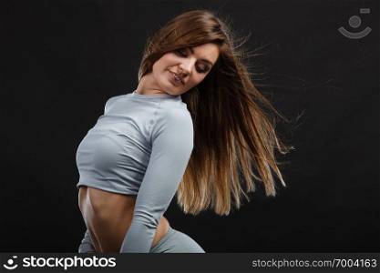 Fit fitness slim woman, positive sporty girl wearing hot gray sports thermolinen underwear, long sleeves top, studio shot on black. Fit woman in thermolinen underwear,