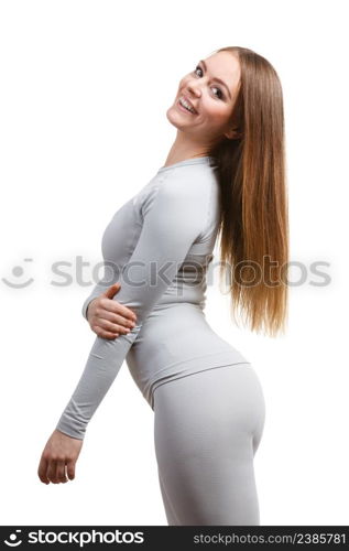 Fit fitness slim woman, sporty girl wearing hot gray sports thermolinen underwear, long sleeves top and leggings. Isolated on white. Fit woman in thermolinen underwear