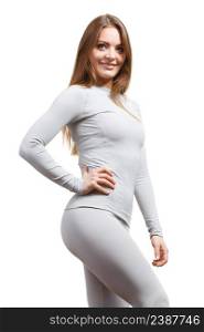 Fit fitness slim woman, sporty girl wearing hot gray sports thermolinen underwear, long sleeves top and leggings. Isolated on white. Fit woman in thermolinen underwear
