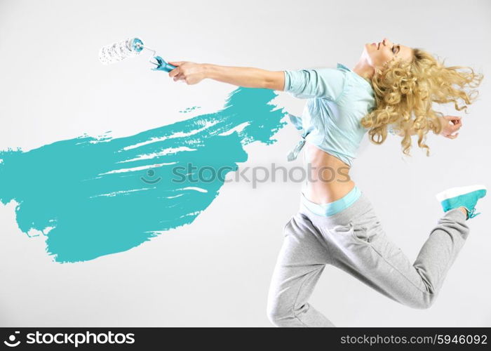 Fit lady painting empty walls