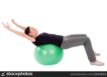 Fit woman doing abdominal stretch exercise with gym ball, isolated on white background.