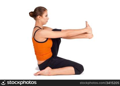 Fit woman doing first stage of yoga exercise called Heron Pose, sanskrit name: Krounchasana, isolated over white background