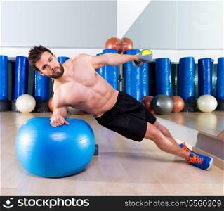 Fitball abdominal side push ups Swiss ball man pushup at fitness gym
