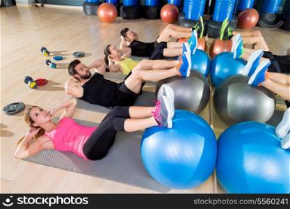 Fitball crunch training group core fitness at gym abdominal workout
