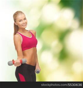 fitness and diet concapt - young sporty woman with light dumbbells