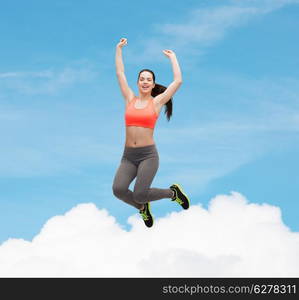 fitness and diet concept - beautiful sporty teenage girl jumping in sportswear