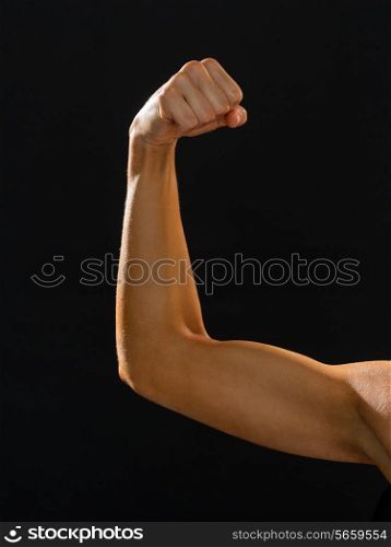 fitness and diet concept - close up of athletic woman flexing her biceps