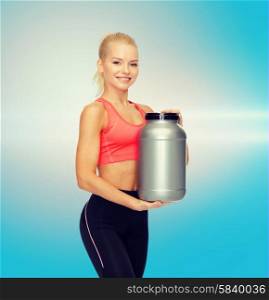 fitness and diet concept - smiling sporty woman with jar of protein. smiling sporty woman with jar of protein