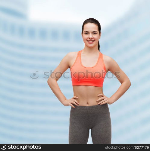 fitness and diet concept - smiling teenage girl in sportswear