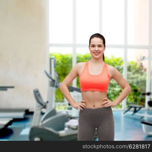 fitness and diet concept - smiling teenage girl in sportswear